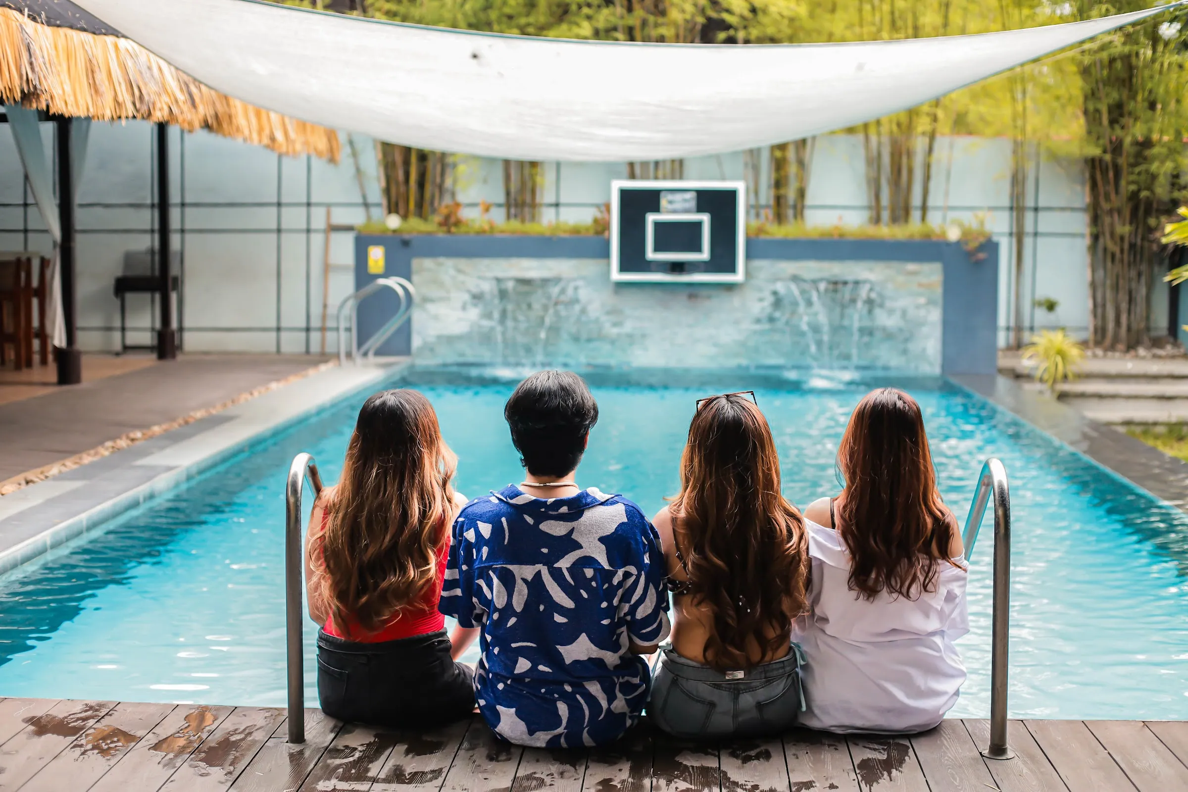 A barkada relaxing together by the private pool
