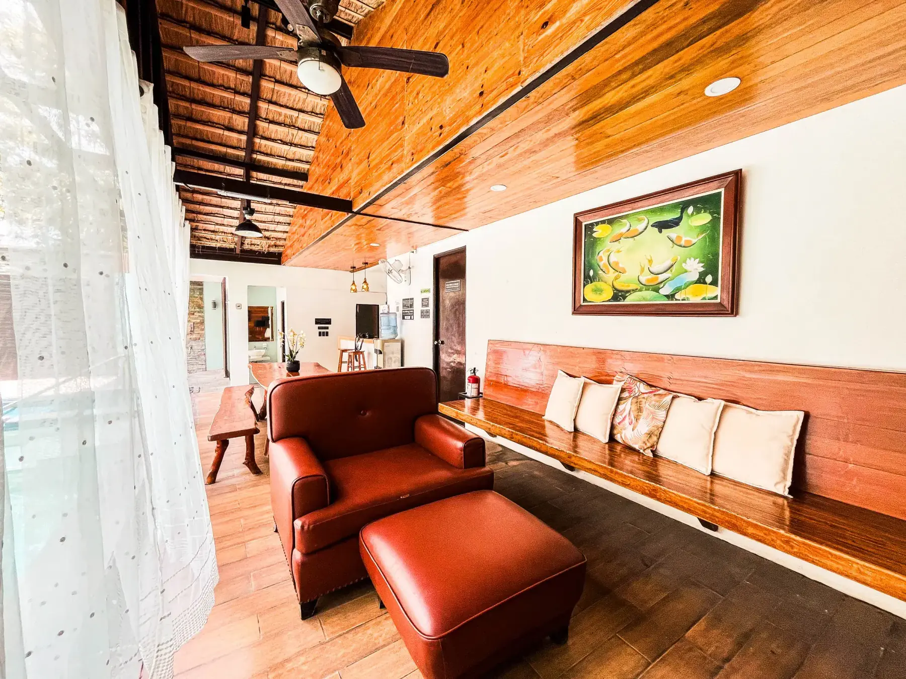 Casita — lounge with a leather armchair under a vaulted ceiling
