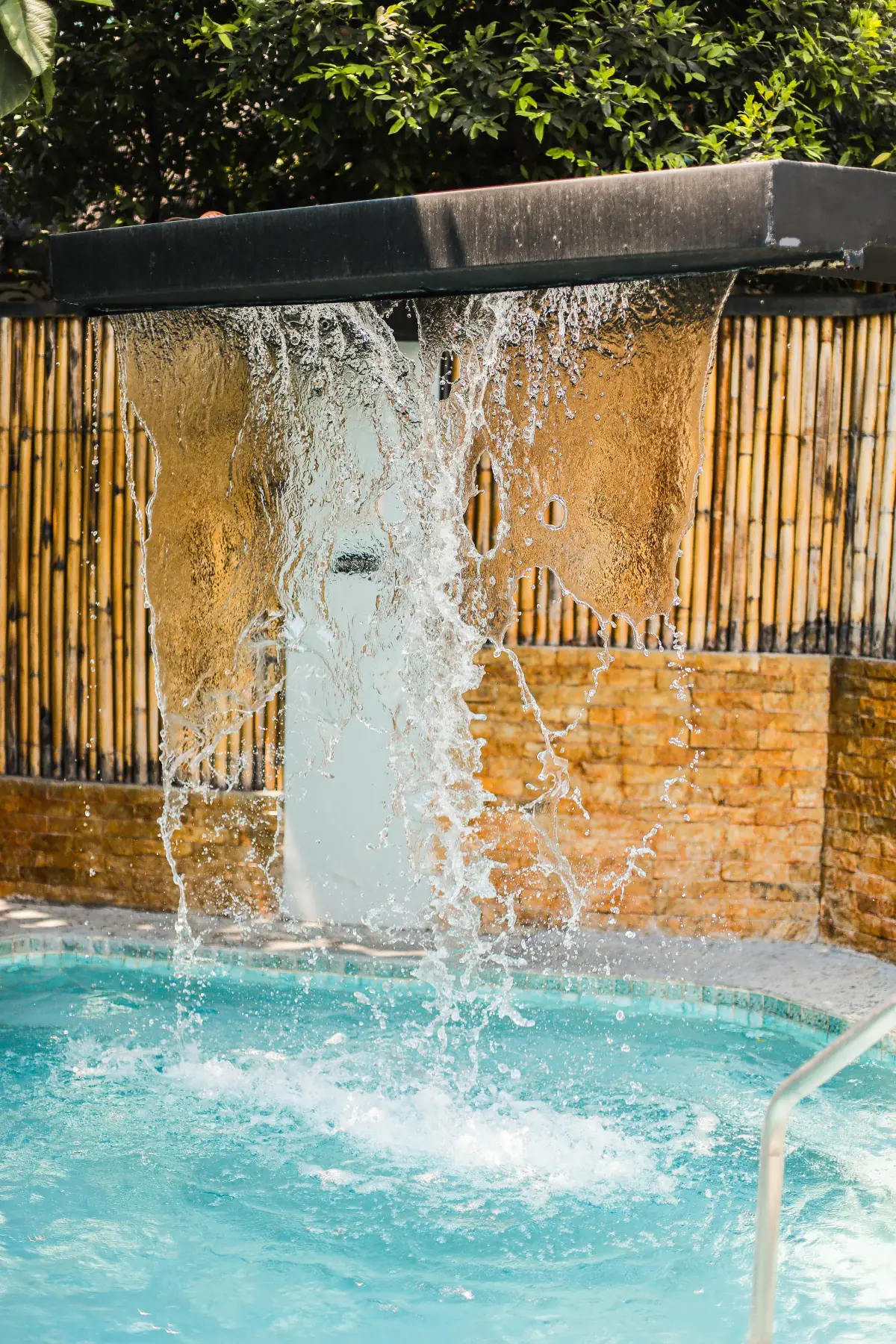Villa 2 — blade waterfall feeding the private plunge pool