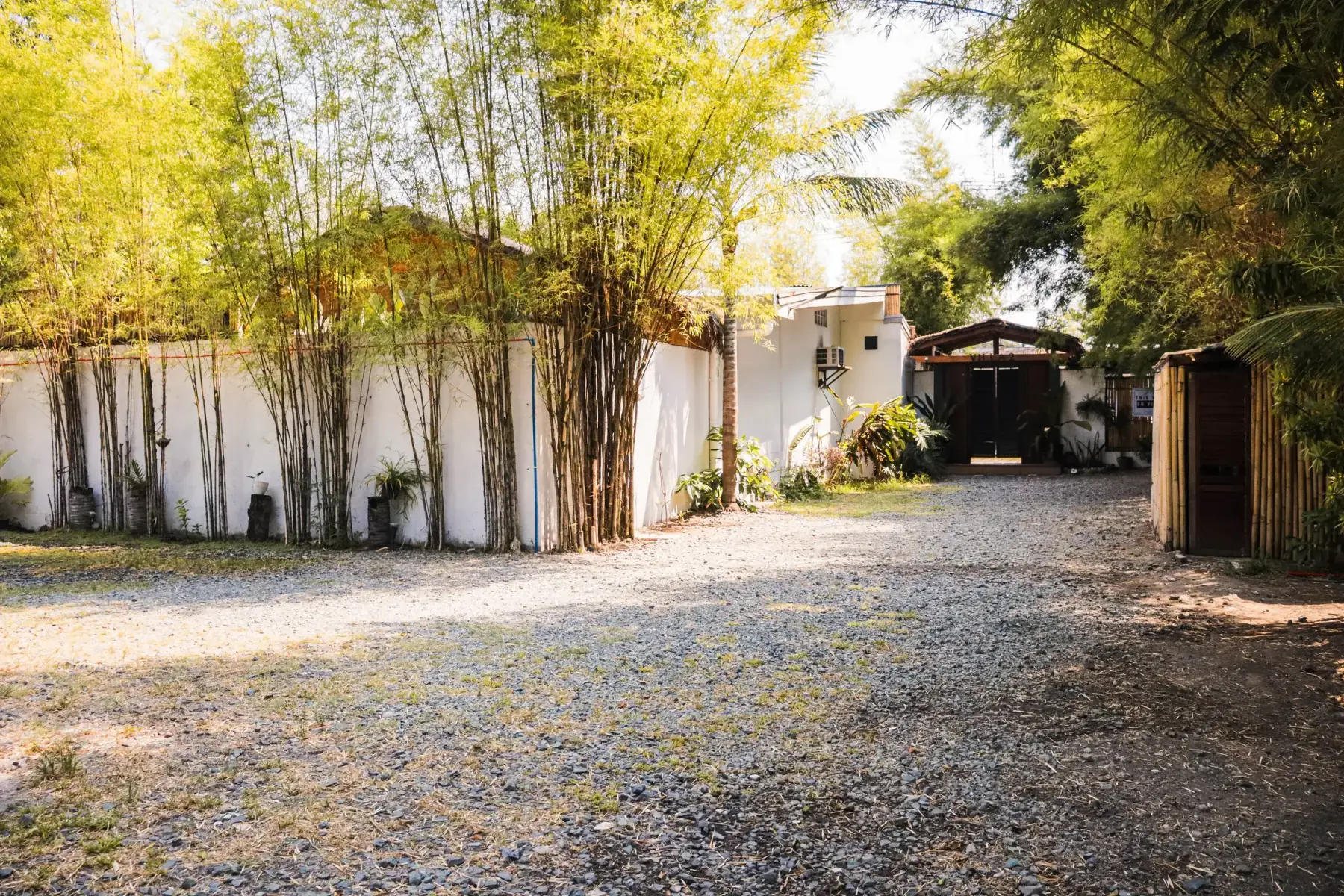 Villa 2 — gravel parking area inside the compound