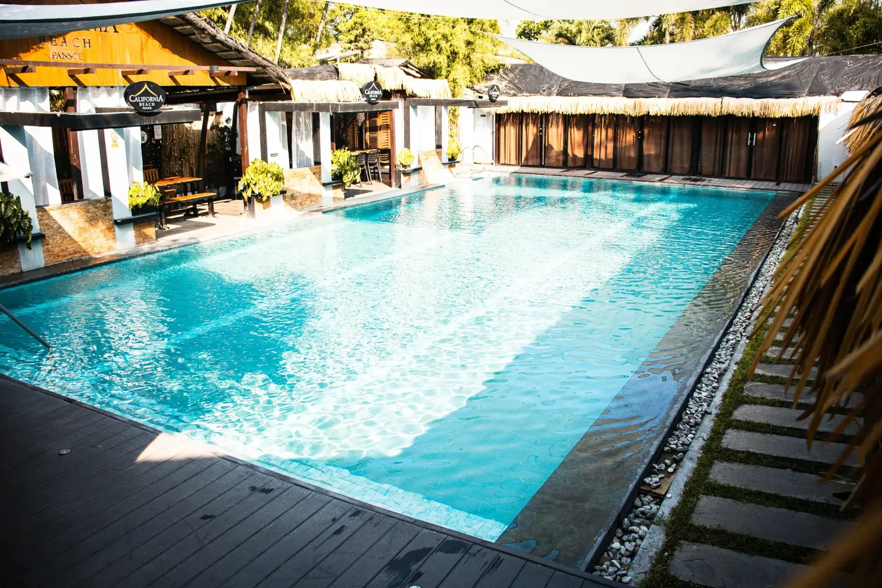 Villa 2 — corner view of the private pool and cabana rooms