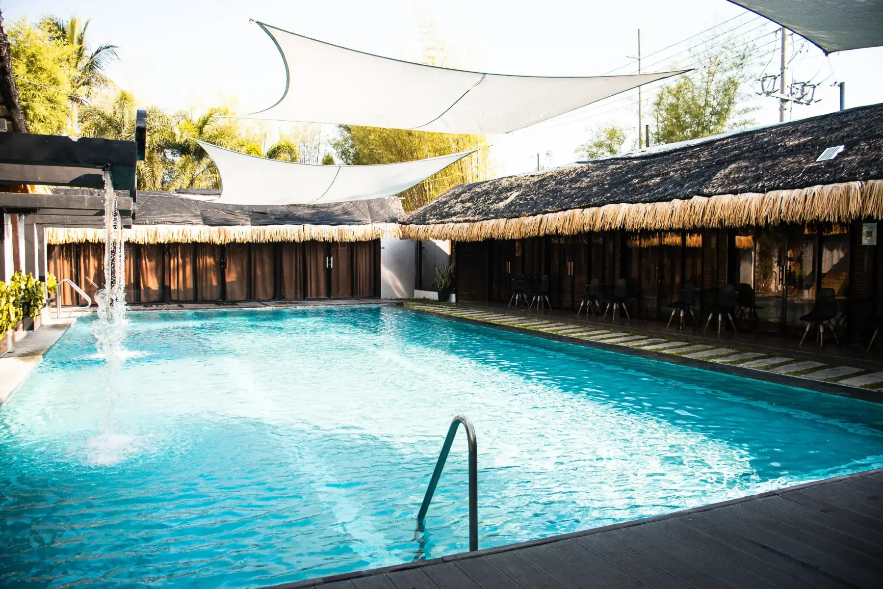 Villa 2 — wide view of the private pool with fountain jet