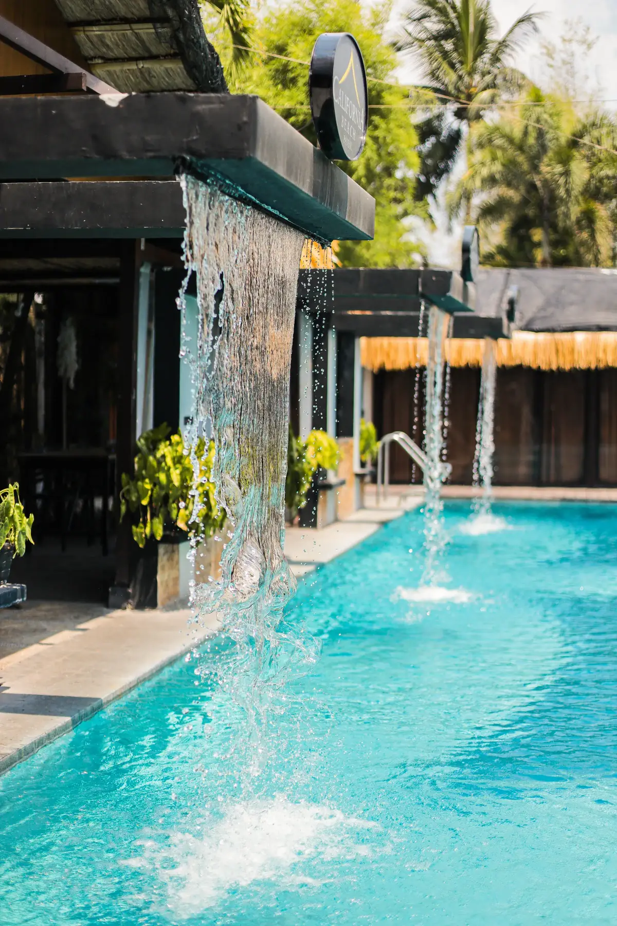 Villa 2 — twin waterfalls off the pergola into the private pool