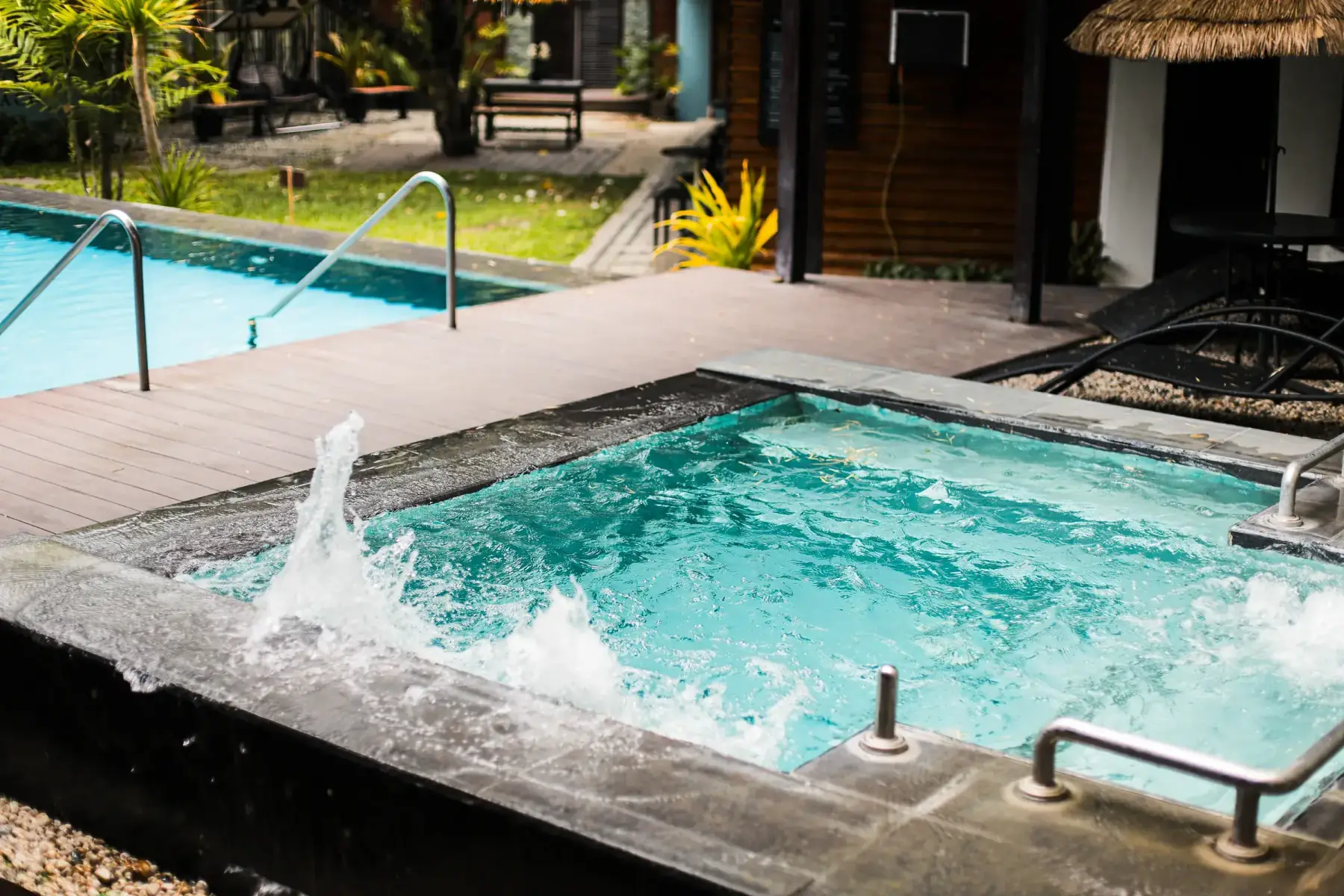 Villa 3 — built-in stone jacuzzi beside the pool