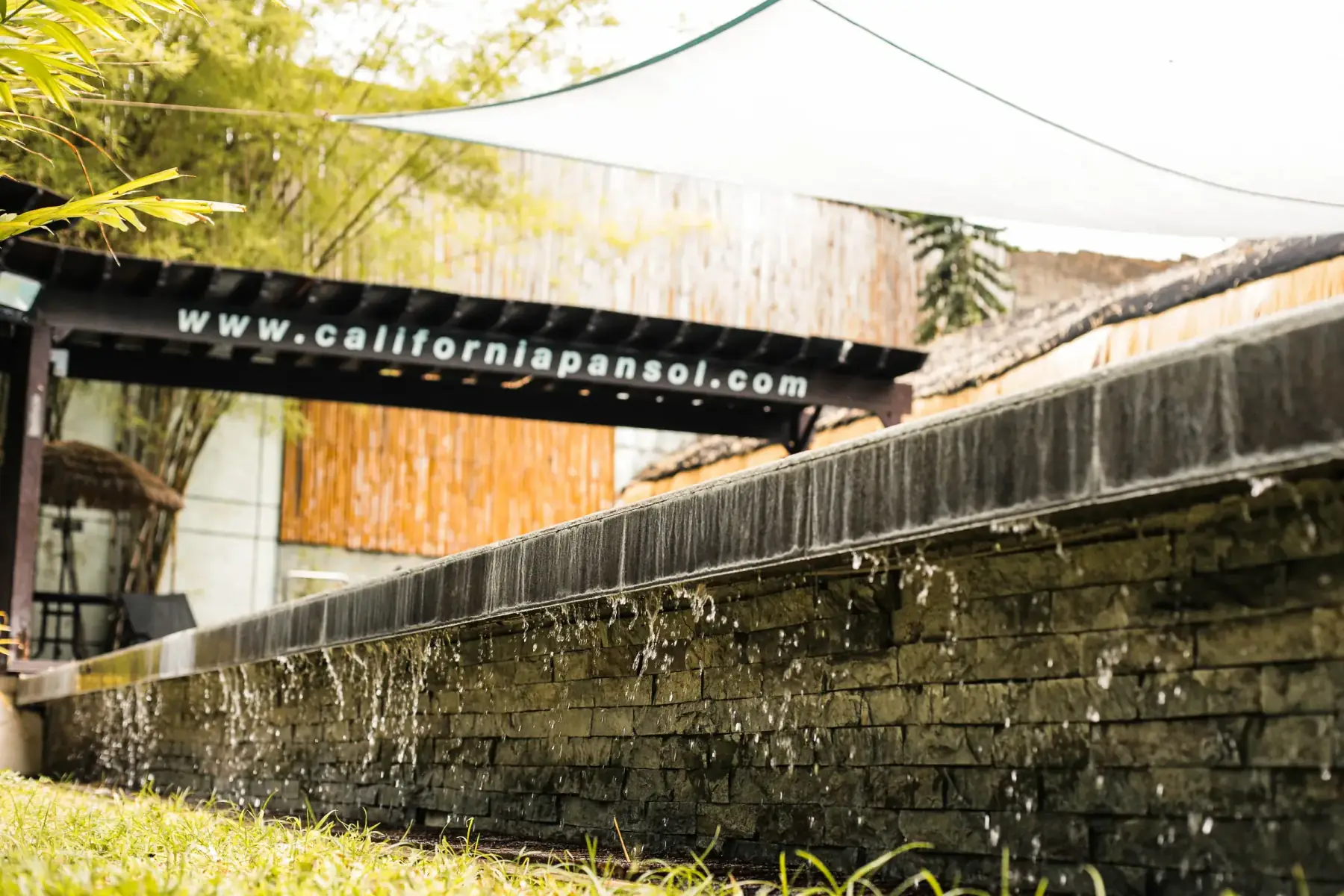 Villa 3 — stone water-feature wall and garden pergola
