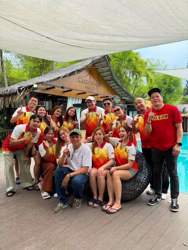 The 93.9 iFM team at California Beach Pansol, poolside by the resort clubhouse